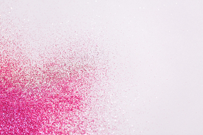 party, decoration and holidays concept - pink glitters on white background