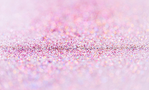party, decoration and holidays concept - multicolored glitters on white background