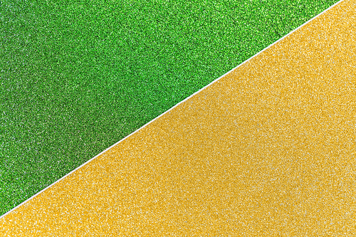 party, texture and holidays concept - green and golden yellow glitters or sequins backgrounds