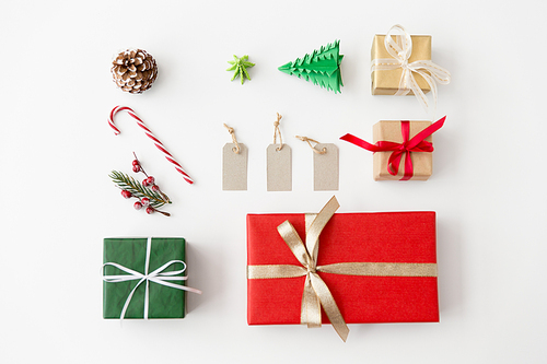 winter holidays, new year and christmas concept - set of gift boxes, tags and decorations on white background