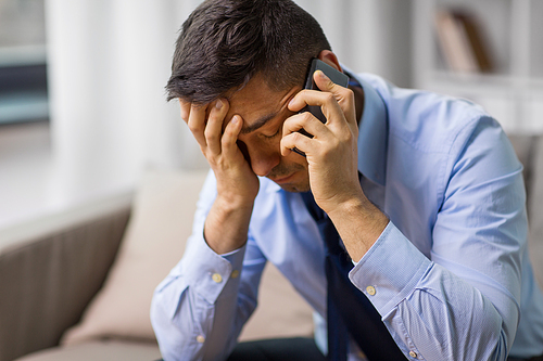 stress, crisis and people concept - unhappy man calling on smartphone