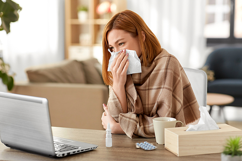 medicine, healthcare and technology concept - sick young woman having video call or online consultation on tablet pc computer at home