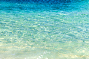 travel, tourism, vacation and summer holidays concept - sea or ocean with transparent blue water