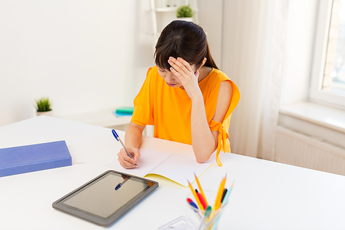 education, technology and people concept - asian student girl with tablet pc computer learning at home