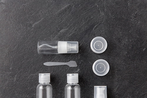 beauty, cosmetics and hygiene concept - toiletry bottle set for travel kit