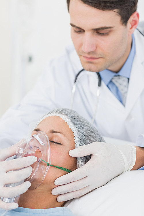 Female patient receiving artificial ventilation