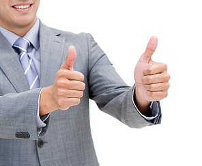 Close up of a young businessman with thumbs up