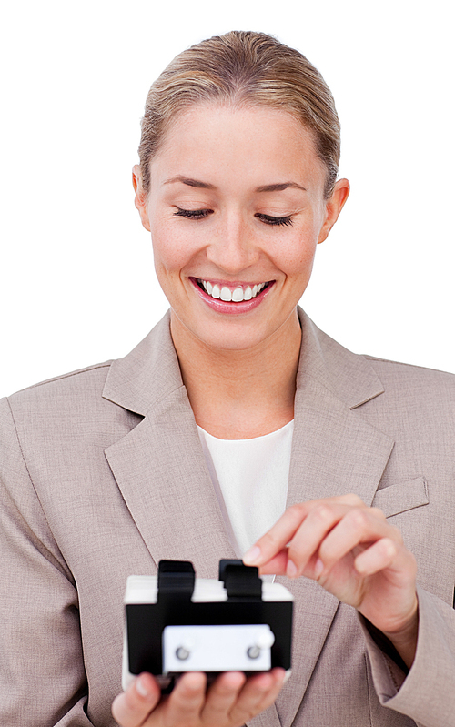 Happy businesswoman consulting a business card holder 