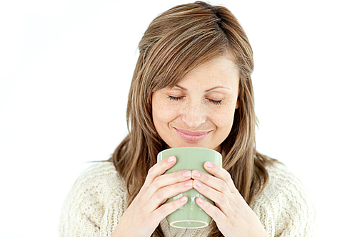 Delighted woman holding a cup a coffee