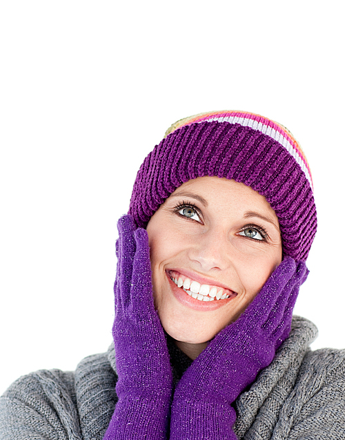 Bright woman with purple gloves and a colourful hat against white background