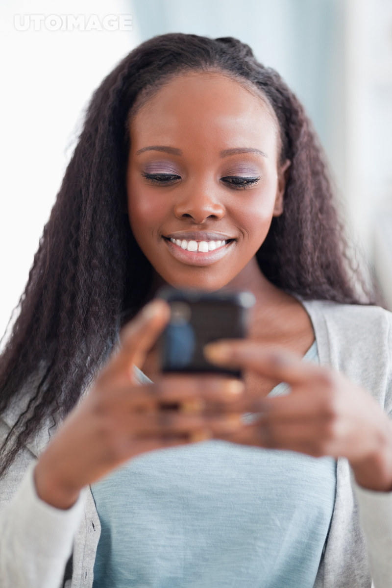 Close Up Of Happy Woman Reading Text Message