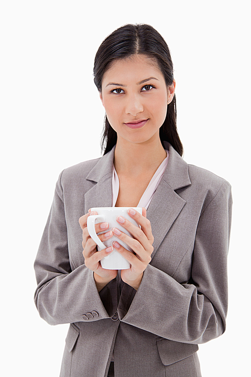 Businesswoman holding cup
