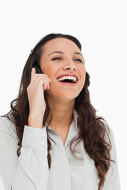 유토이미지 Attractive Brunette Woman Laughing While Talking On The Cellphone