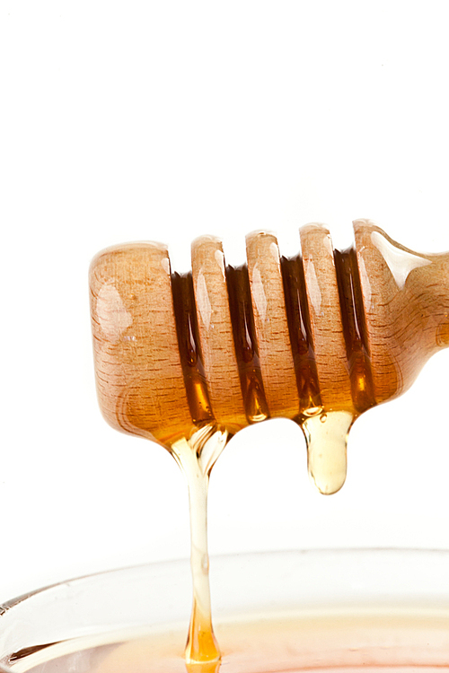 Honey trickle on the top of a honey full bowl