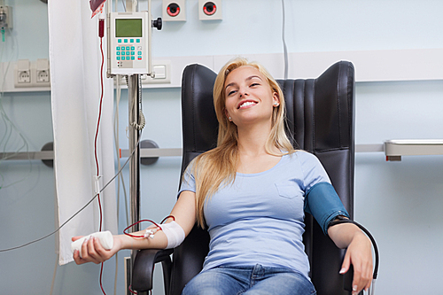 Smiling patient being transfused