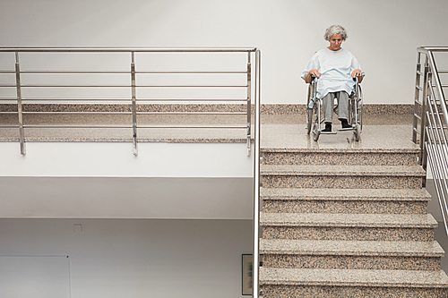 elderly lady in . at top of stairs