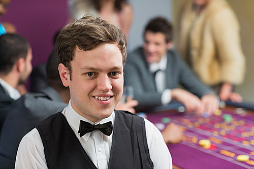 Dealer standing at roulette table