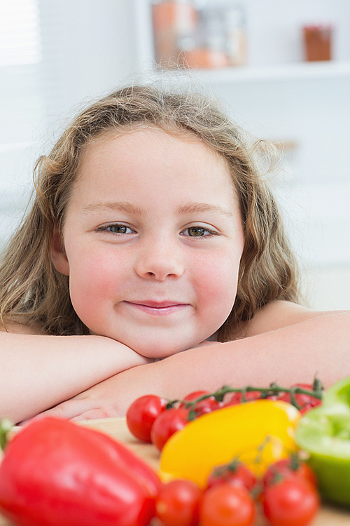 Close up of girl leaning on table