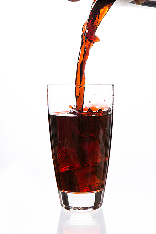 Soda being poured in a glass