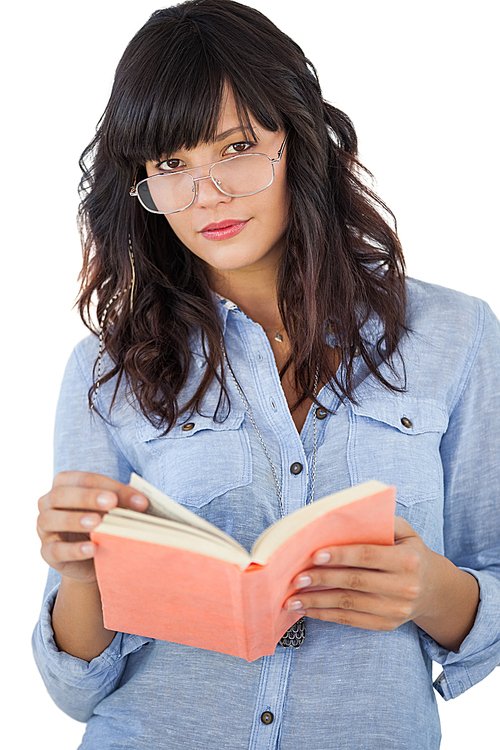 Beautiful woman wearing glasses and holding book