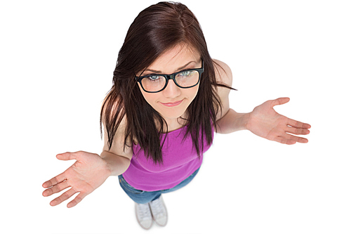 High angle view of uncertain brunette with glasses posing