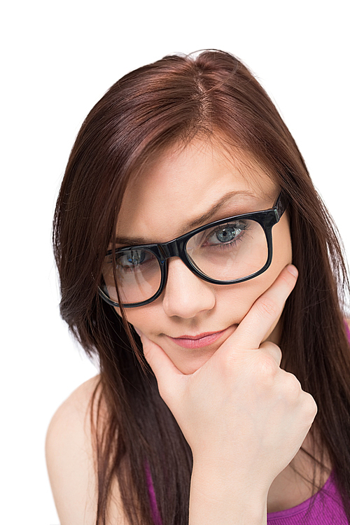 Close up on thinking brunette with glasses 