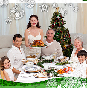 Family celebrating christmas dinner with turkey