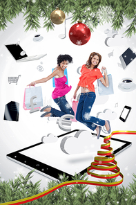 Composite image of two smiling women jumping on a tablet pc 