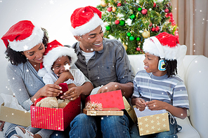 Happy family opening christmas presents