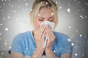 Closeup of a young woman suffering from cold