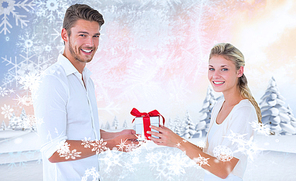 Composite image of young couple with gift