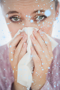 Composite image of unhappy young woman suffering from cold