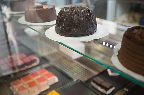 Display of fresh brownies and chocolate cakes at the bakery