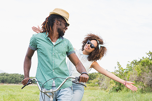 Young couple on a bike ride on a sunny day