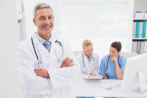 Smiling doctor  in medical office