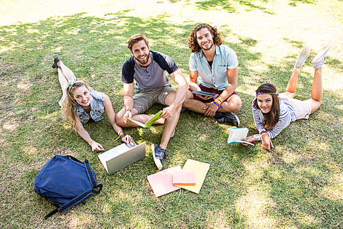 Classmates revising together on campus on a summers day