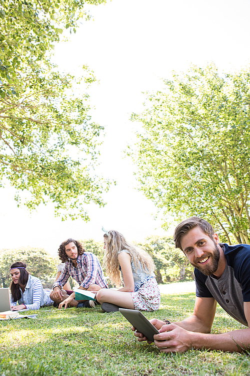 Classmates revising together on campus on a summers day