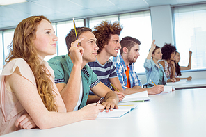 Fashion students being attentive in class at the college