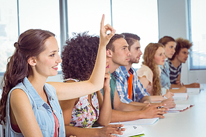 Fashion students being attentive in class at the college