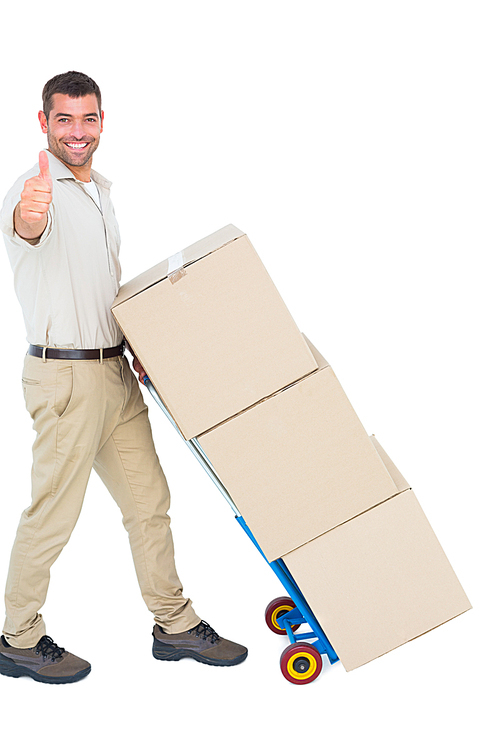 Full length portrait of happy delivery man with cardboard boxes gesturing thumbs up on white background