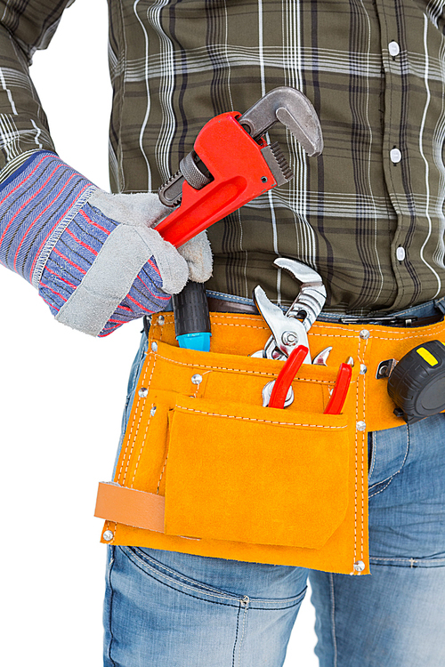 Handyman holding hand tool on white background