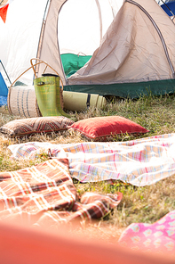 Bohemian style campsite at festival on a sunny day