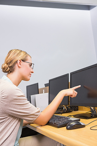 Student working on computer in classroom at the university