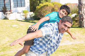 Father and son in the countryside on a sunny day