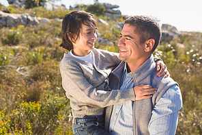 Father and son in the countryside on a sunny day