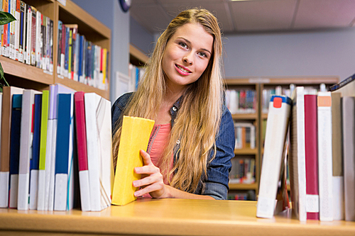 Pretty student in the library at the university