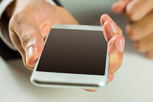 Businessman using his smart phone in close up