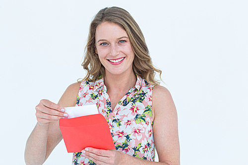 Smiling woman with letter on white background