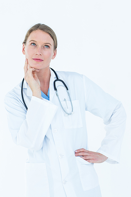Thoughtful doctor thinking about work on white background