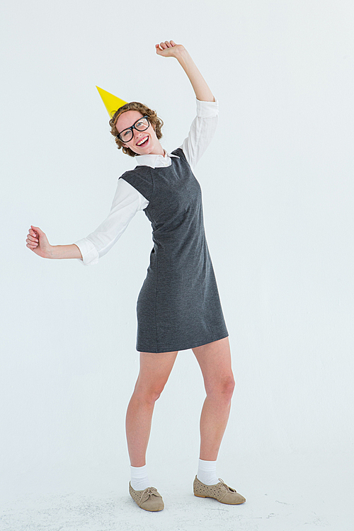 Geeky hipster wearing a party hat on white background